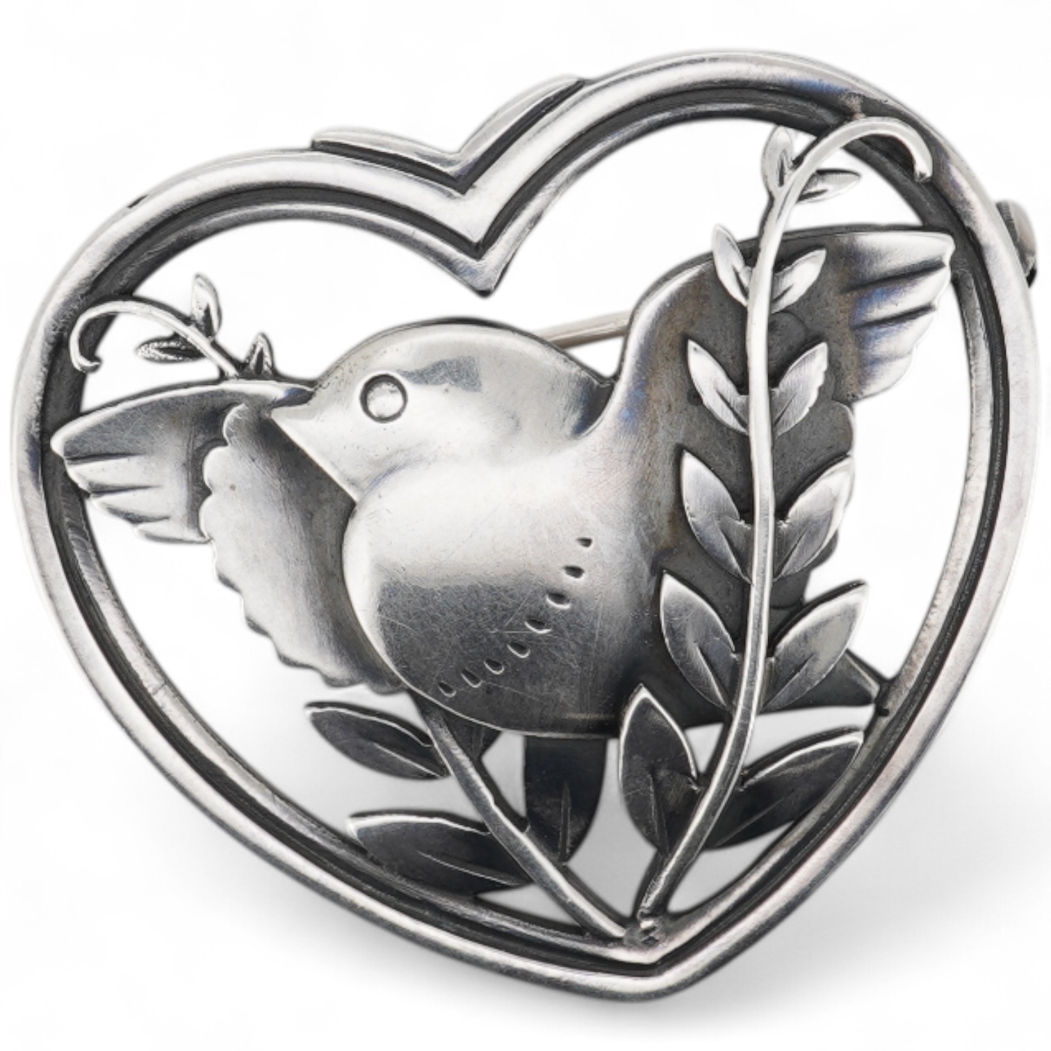 A Georg Jensen sterling heart shaped brooch, designed by Arno Malinowski, depicting a robin with frond, design no. 239, width 40mm.